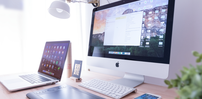 Desk with a mac and a macbook on display mac-and-macbook-on-desk